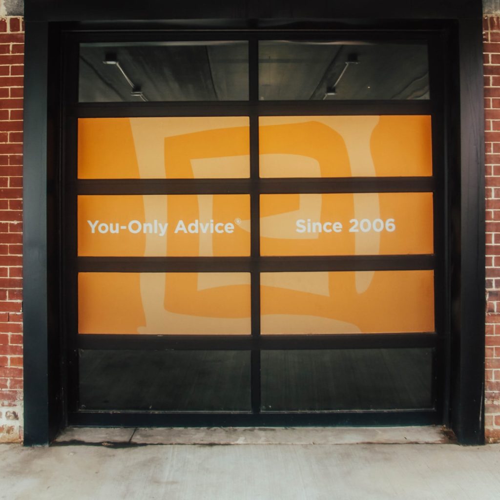 You-Only Advice since 2006 slogan on window at EVOadvisers office